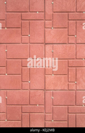 Red decorative tiles on the wall for the background. Stock Photo
