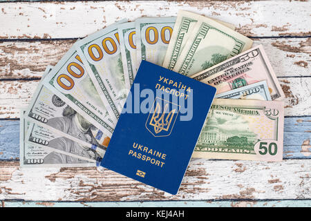 International biometric Ukrainian passport with us dollars top view Stock Photo