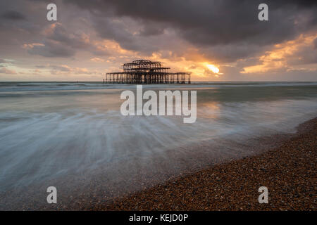Sunset at West Pier ruins in Brighton, East Sussex, England. Stock Photo