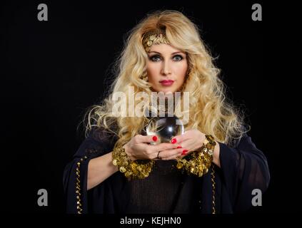 Woman fortune teller with crystal ball portrait Stock Photo