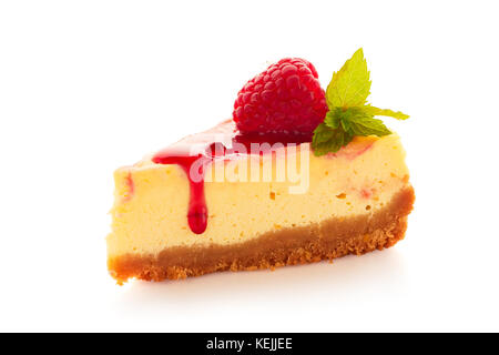 Piece of homemade cheesecake decorated with raspberries and mint on white Stock Photo