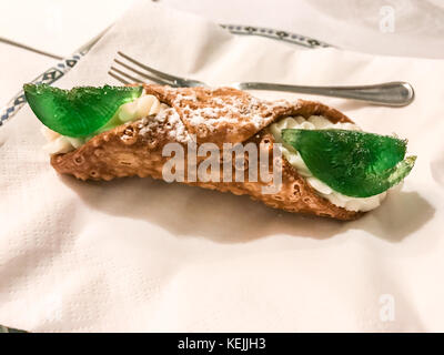 close up of Sicilian Cannolo isolated on white background, traditional italian dessert with ricotta Stock Photo