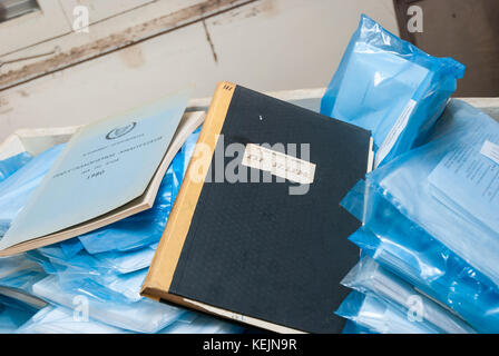 Doctor office with log books from 1957 in abandoned sanatorium - hospital room Stock Photo