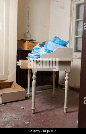 Doctor office with log books from 1957 in abandoned sanatorium - hospital room Stock Photo