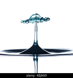 An abstract macro shot of a water drop collision. Stock Photo