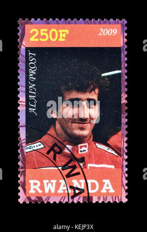 Cancelled postage stamp printed by Rwanda, that shows Alain Prost. Stock Photo