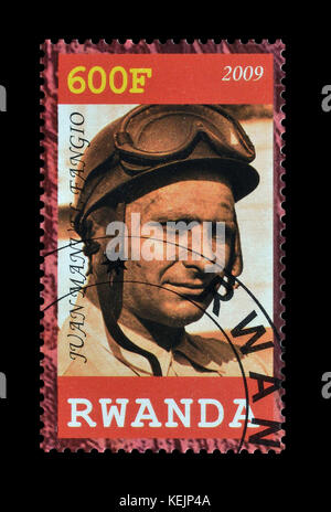 Cancelled postage stamp printed by Rwanda, that shows Fangio. Stock Photo