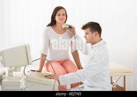 Ultrasound Scanning Of A Thyroid Of A Female Patient In The Clinic Stock Photo