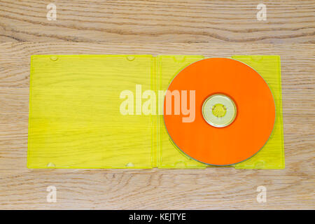 Listen to the music, orange cd and yellow plastic case Stock Photo