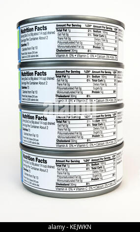 Stacked cans of tuna with nutritional information on label. Stock Photo