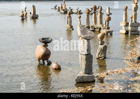 2017 Inukshuks: For more then 30 years Inukshuks, or balanced rock sculptures, have been at Remics Rapids on the Ottawa River just west of downtown Ot Stock Photo