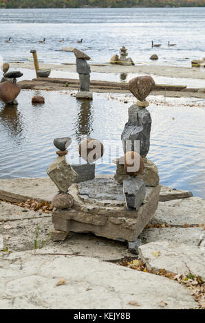 2017 Inukshuks: For more then 30 years Inukshuks, or balanced rock sculptures, have been at Remics Rapids on the Ottawa River just west of downtown Ot Stock Photo