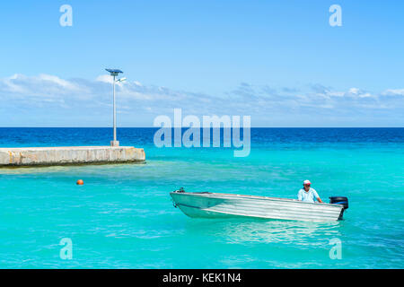 Small motorboat at sea in Rangiroa, French Polynesia Stock Photo