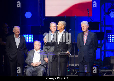 College Station, Texas USA Oct. 21, 2017: The five living former U.S. Presidents onstage at Texas A&M University for a One America Appeal benefit concert and fund raiser for hurricane and storm relief. Presidents George H.W. Bush, George W. Bush, Barack Obama and Bill Clinton appear midway in the concert. Credit: Bob Daemmrich/Alamy Live News Stock Photo