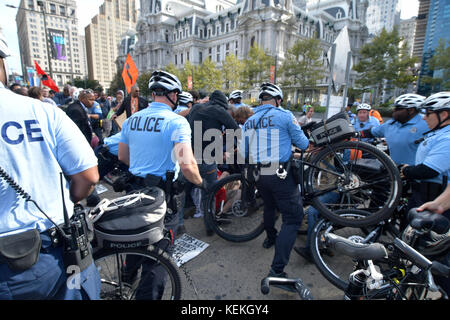 Philadelphia, PA., USA. 21st October, 2017. Protestors with REAL Justice Philadelphia confront police  on October 21, 2017 after US Attorney General Jeff Sessions delivers remarks on the Project Safe Neighborhoods during the Major Cities Chiefs Association Fall Meeting, at the nearby Pennsylvania Convention Center, in Philadelphia, PA. Upon arrival at the Frank Rizzo statue, near City Hall police officers and protesters clashed. Five people were detained, and according to a Philadelphia Police supervisorÊat the location Òwill most likely be sent home later with a citation. Stock Photo