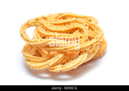 Traditional Indian Diwali snacks Chakali, isolated on white. Stock Photo