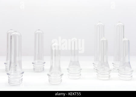 https://l450v.alamy.com/450v/kekt55/group-of-transparent-plastic-pet-preforms-are-displayed-on-the-shelf-kekt55.jpg