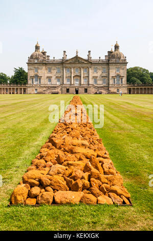 Houghton Hall in West Norfolk, build for Robert Walpole in 1722-1735.  A Line in Norfolk by Richard Long in foreground. Stock Photo