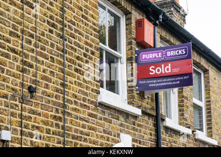 A sign on a house sold by Purple Bricks online estate agents