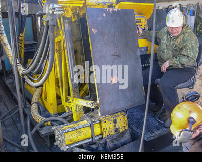 Intelligence Drilling wells. Search for traces of the presence of gold by drilling wells to extract Intelligence core. Stock Photo