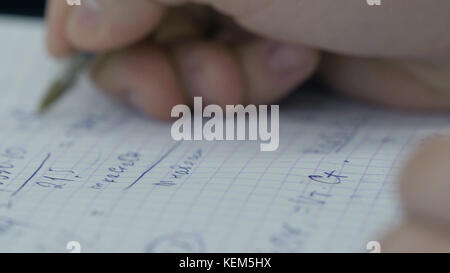 Girl considers checks on the calculator. Hands woman calculator money. Female office workers holding are arranging documents of unfinished documents archive analyzing the market Stock Photo