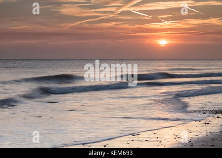 Sunrise at Walcott, on the Norfolk coast. Stock Photo