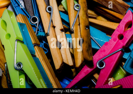 Wooden and plastic clothes pegs Stock Photo