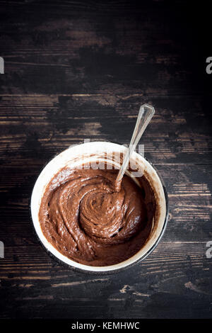 Basic homemade brownie or chocolate cake raw dough in baking pan. Cooking (baking) homemade chocolate cake or brownie. Stock Photo