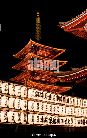 Senso-ji Buddhist temple old pagoda at night with traditional japanese lanterns in Asakusa, Tokyo Stock Photo