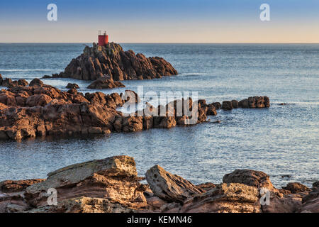 Offshore rocks and lighthouse on the entrance channel to the Port of Tauranga, Bay of Plenty, New Zealand. Stock Photo