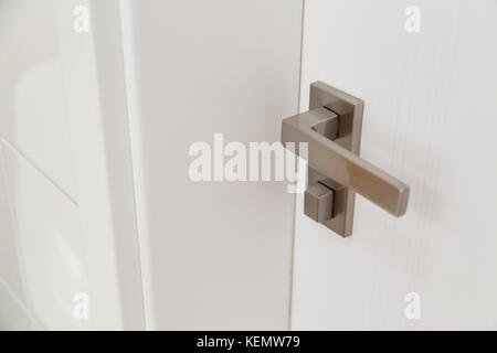 Metal door handle of modern style bathroom Stock Photo