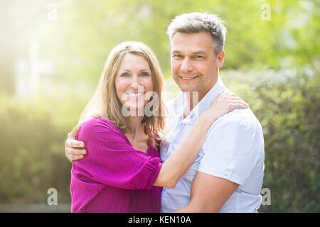 Portrait Of Happy Couple Hugging Each Other Stock Photo
