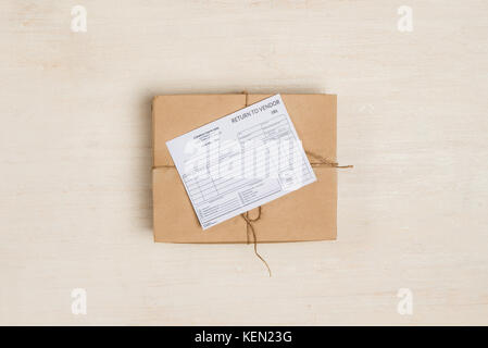 Delivery receipt on cardboard box at table Stock Photo