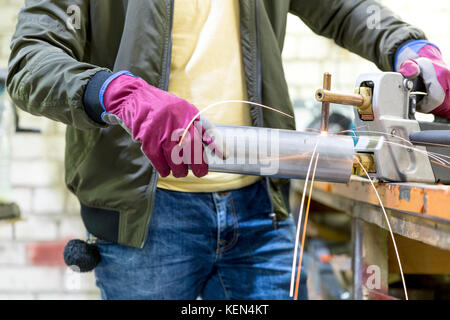 Experienced operator. Metalworking industry concept professional engineer metalworker operating milling machine center in tool manufacturing workshop Stock Photo
