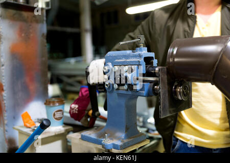 Experienced operator. Metalworking industry concept professional engineer metalworker operating milling machine center in tool manufacturing workshop Stock Photo
