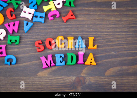 social media. various colored wooden letters on a dark plate Stock Photo
