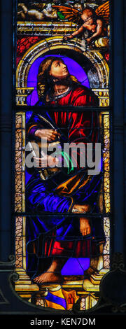Stained Glass in the Basilica of San Petronio, Bologna, Emilia Romagna, Italy, depicting Saint Matthew or Mattheus the Evangelist Stock Photo