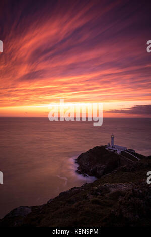 South Stack Lighthouse at sunset, Holy Island, Anglesey, Wales Stock Photo