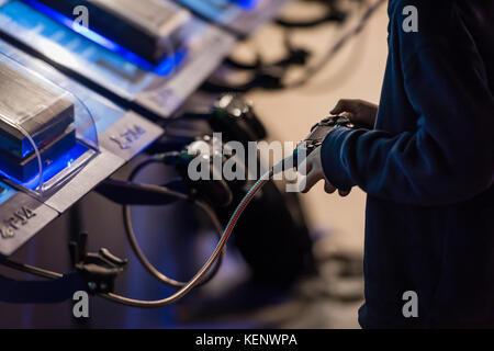 Zurich, Switzerland. 22nd Oct, 2017. Visitors of Zurich Game Show 2017 at Zurich's exhibition centre are trying out computer games. Zurich Game Show is Switzerland's largest annual eSports and computer game event. Credit: Erik Tham/Alamy Live News Stock Photo