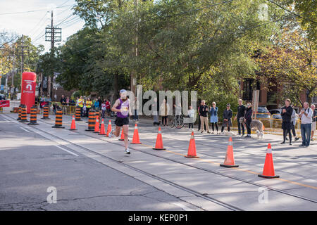 Toronto, Canada. 22nd October, 2017. Canadian marathon runner John Mason passing the 33km turnaround point at the 2017 Scotiabank Toronto Waterfront Marathon. He achieves the fifteenth place in the race. Credit: YL Images/Alamy Live News Stock Photo