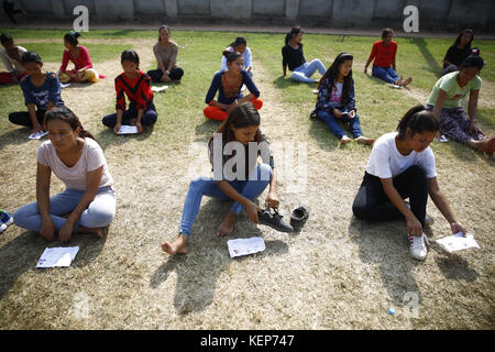 Lalitpur, Nepal. 23rd Oct, 2017. Nepalese women get ready during a training exercise for the selection of temporary cops for the upcoming provincial and parliamentary elections in Lalitpur, Nepal on Monday, October 23, 2017. The government of Nepal is recruiting 98, 168 temporary police for the upcoming elections. Credit: Skanda Gautam/ZUMA Wire/Alamy Live News Stock Photo