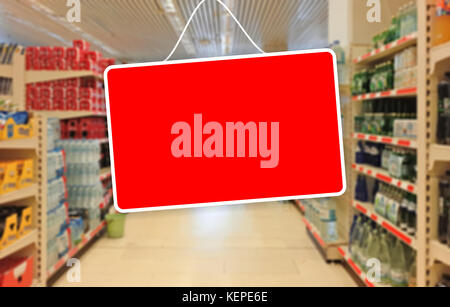 Red blank label on a blur Supermarket background Stock Photo