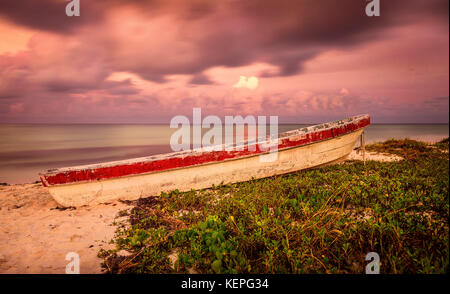 Old Fishing Boat sitting on the Beach Stock Photo