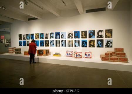 A spectator looking at Warhol art exhibited at the Andy Warhol Museum in downtown Pittsburgh, Pennsylvania. Stock Photo