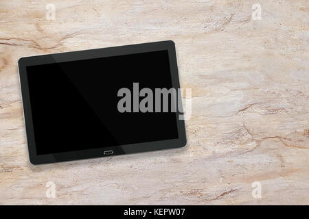 Mockup of a modern black silver digital tablet on a marble desk ( high angel view) Stock Photo
