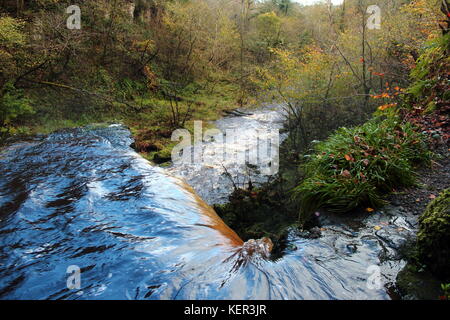 Lynn falls, on Lugton Water west of Dalry, North Ayrshire, Scotland with autumn trees in background. Stock Photo