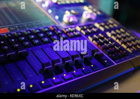 Compact lighting control console for music shows and concerts. Selective focus. Stock Photo