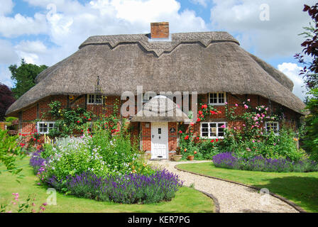 Thatched country cottage and garden, Itchen Stoke, Hampshire, England, United Kingdom Stock Photo