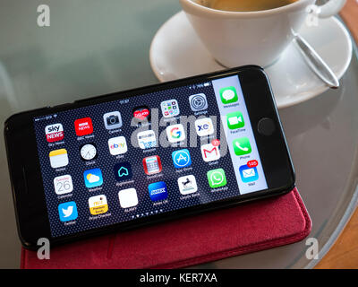 iPhone apps lifestyle connection smartphone applications screen cafe table, landscape orientation UK based screen apps on display SFR WiFi signal Stock Photo