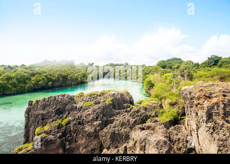 Scenery of natural lake with surrounded by cliffs on Weekuri, Sumba, Indonesia Stock Photo